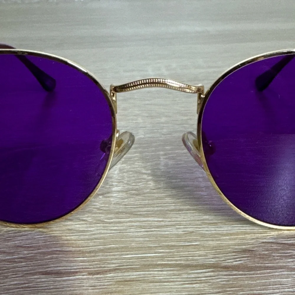 Rainbow OPTX Round sunglasses a gold metal frame and indigo purple lenses